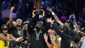 LeBron James lifts NBA Cup after Lakers win the first NBA In-Season Tournament.